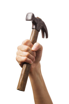 Hand raised up holds hammer isolated on white background