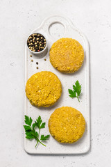fresh turkey rissoles on white plate with parsley. Top view, copy space.