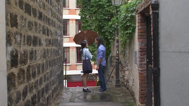 Couple under the rain in Paris, France
