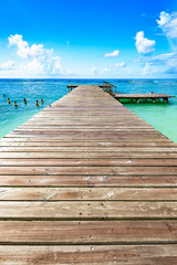 wooden bridge juts out into of the sea Dominican Republic