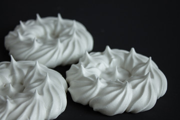 White meringue on black background