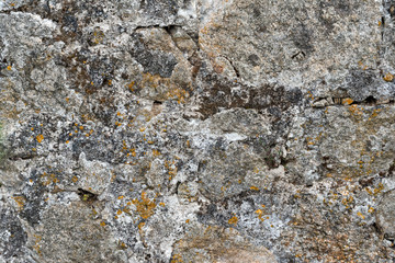 Texture of a stone wall. Old castle stone wall background. Wall made of wild stone. Natural background.
