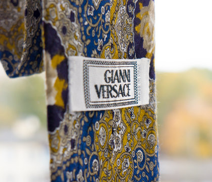 GOMEL, BELARUS - OCTOBER 25, 2019: Gianni Versace tie. Gianni Versace S.r.l. usually referred to simply as Versace, is an Italian luxury fashion company founded by Gianni Versace in 1978.