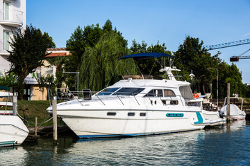 Fototapeta premium Beautiful yacht moored at the dock in Caorle - Italy