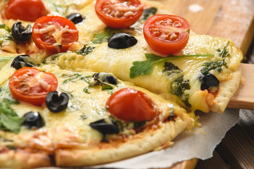 Pizza with wine tomatoes cheese and arugula