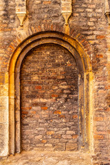 Brick wall with representative and decorative arch