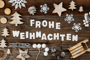 White Letters Building The Word Frohe Weihnachten Means Merry Christmas. Wooden Christmas Decoration Like Tree, Sled And Star. Brown Wooden Background