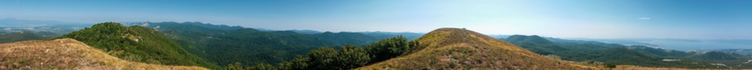 Mountain and hills panorama with the the sea and sky in the background. Tuhobić, Hreljin, Croatia