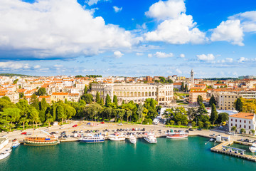 Croatia, city of Pula, ancient Roman arena, historic amphitheater and old town center from drone,...