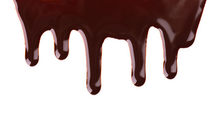 Chocolate streams isolated on white background. Chocolate syrup, topping, dark chocolate.