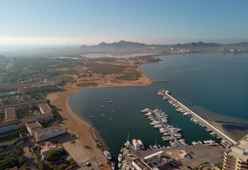 Aerial panoramic photography drone point of view La Manga del Mar Menor townscape and seaside spit of Mediterranean Sea, Mar Menor in Region of Murcia, Spain