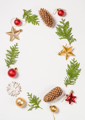 Christmas flat lay background with golden decorations on white.