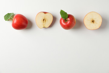 Flat lay with red apples on white background, space for text