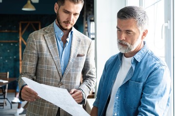 Business colleagues discussing together in an office.