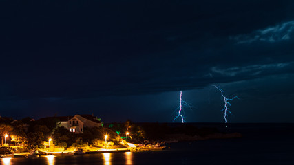 Naklejka na ściany i meble Clouds and thunder lightnings and storm in Croatia
