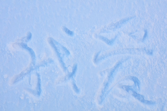 “I love” words written on the snow