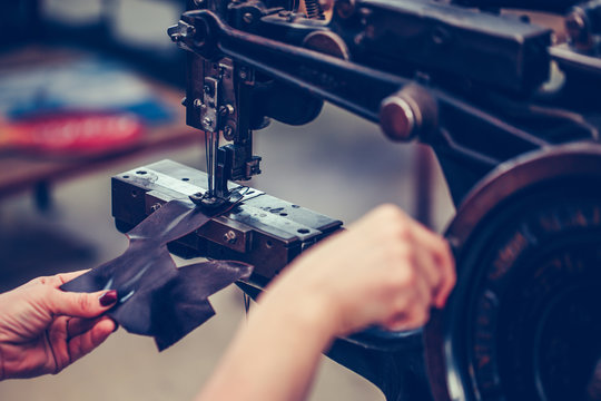 Close Up Of A Female Shoemaker Hands Stitching A Part Of The Shoe