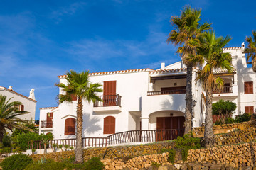 Fototapeta premium Traditional Spanish architecture with white summer villas on the island of Menorca. Spain