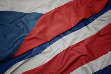 waving colorful flag of costa rica and national flag of czech republic.