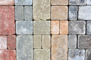 A sampling of colours of tumbled pavers are used to create garden patios, driveways and other landscaping elements.