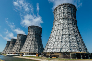 Cooling tower of nuclear power plant against blue sky