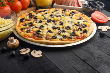 Italian pizza and ingredients. Pizzeria, restaurant, recipe book, home cooking. Horizontal photo with space for design.