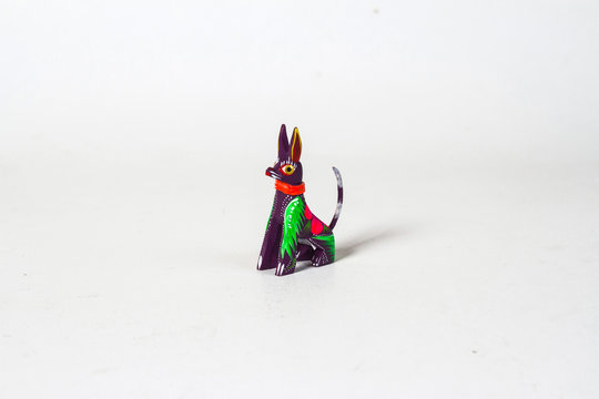 Mexican purple xolo dog alebrije from oaxaca isolated on white background. shot from above