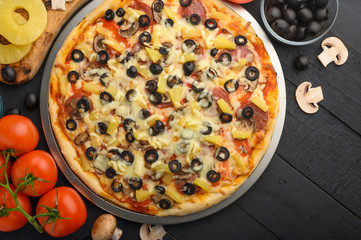 Italian pizza and ingredients. Pizzeria, restaurant, recipe book, home cooking. Horizontal photo with space for design.