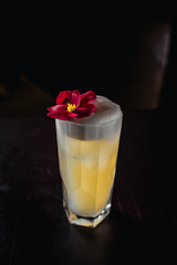 yellow coctail with flowers 