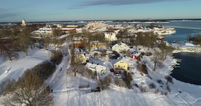  Aerial Helsinki fortress Suomenlinna at the coast of Baltic sea in Helsinki, Finland. Winter view. Winter sunset.