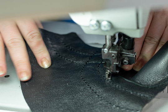 The Process Of Sewing Shoes On A Sewing Machine. Shoe Production.