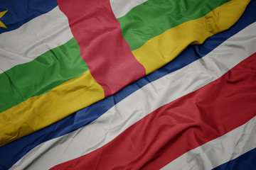 waving colorful flag of costa rica and national flag of central african republic.