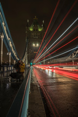 Traffic on Tower Bridge at night.