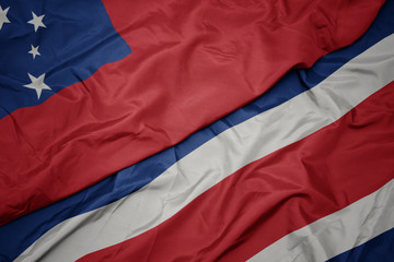 waving colorful flag of costa rica and national flag of Samoa .