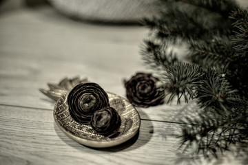 christmas decoration on wooden background with mistletoe branch