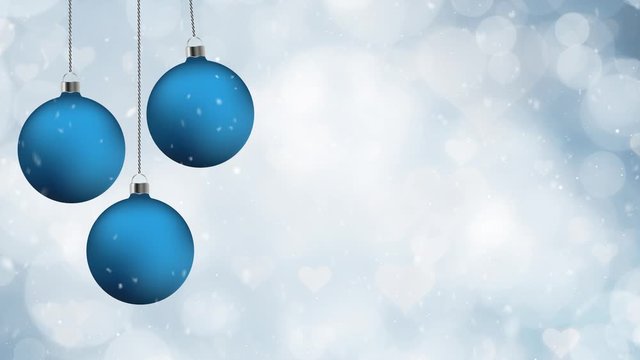 Blue christmas baubles swing on a string with blurry hearts bokeh copy space animtion background.