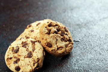Chocolate cookies on wooden table. Chocolate chip cookies shot on table
