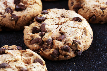 Chocolate cookies on wooden table. Chocolate chip cookies shot on table
