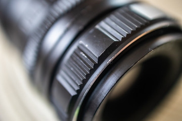 Old vintage manual photo lens with adapter for modern mirrorless camera