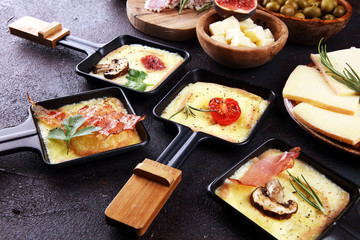 Delicious traditional Swiss melted raclette cheese on diced boiled or baked potato.