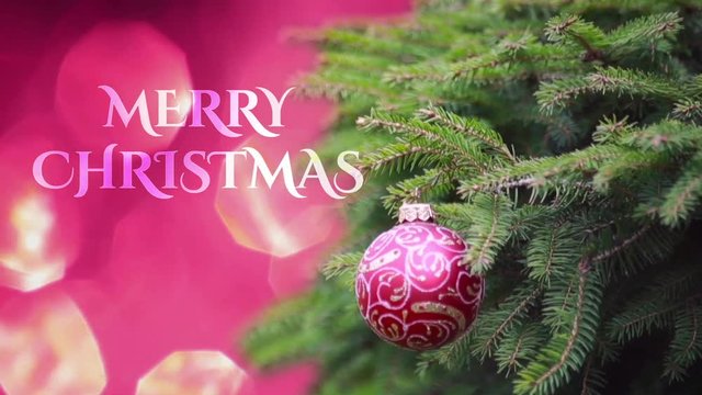 "Merry Christmas" Text against Background with  Red ball on Christmas tree branch