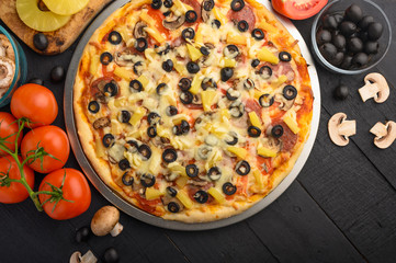 Italian pizza and ingredients. Pizzeria, restaurant, recipe book, home cooking. Horizontal photo with space for design.