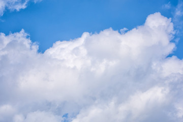 Naklejka na ściany i meble Fluffy white clouds on background of blue sky wallpaper