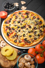 Italian pizza, with ingredients. Cookbook, homemade recipes, restaurant business. Vertical frame