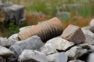 remains of ancient ceramic pipes from the water supply. Prefabricated sections of ceramics from which the pipeline was assembled.