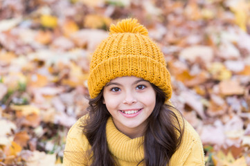 Smile of perfect beauty. Happy small child relax on autumn landscape. Natural beauty. Autumn beauty and fashion. Little beauty model in autumn style