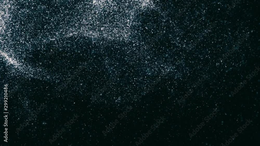 Poster abstract animation of small white particles exploding isolated on dark background. animation. white 