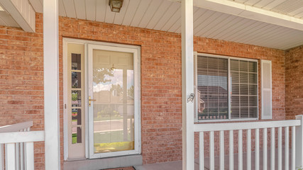 Panorama frame Front porch and door of traditional brick home