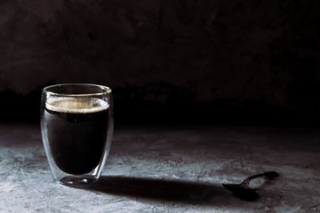 Espresso coffee in shot glass sepia tone with soft shutter