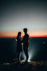 a couple above night city